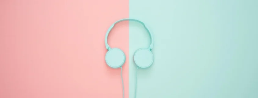 mint blue head phones on mint and pink background